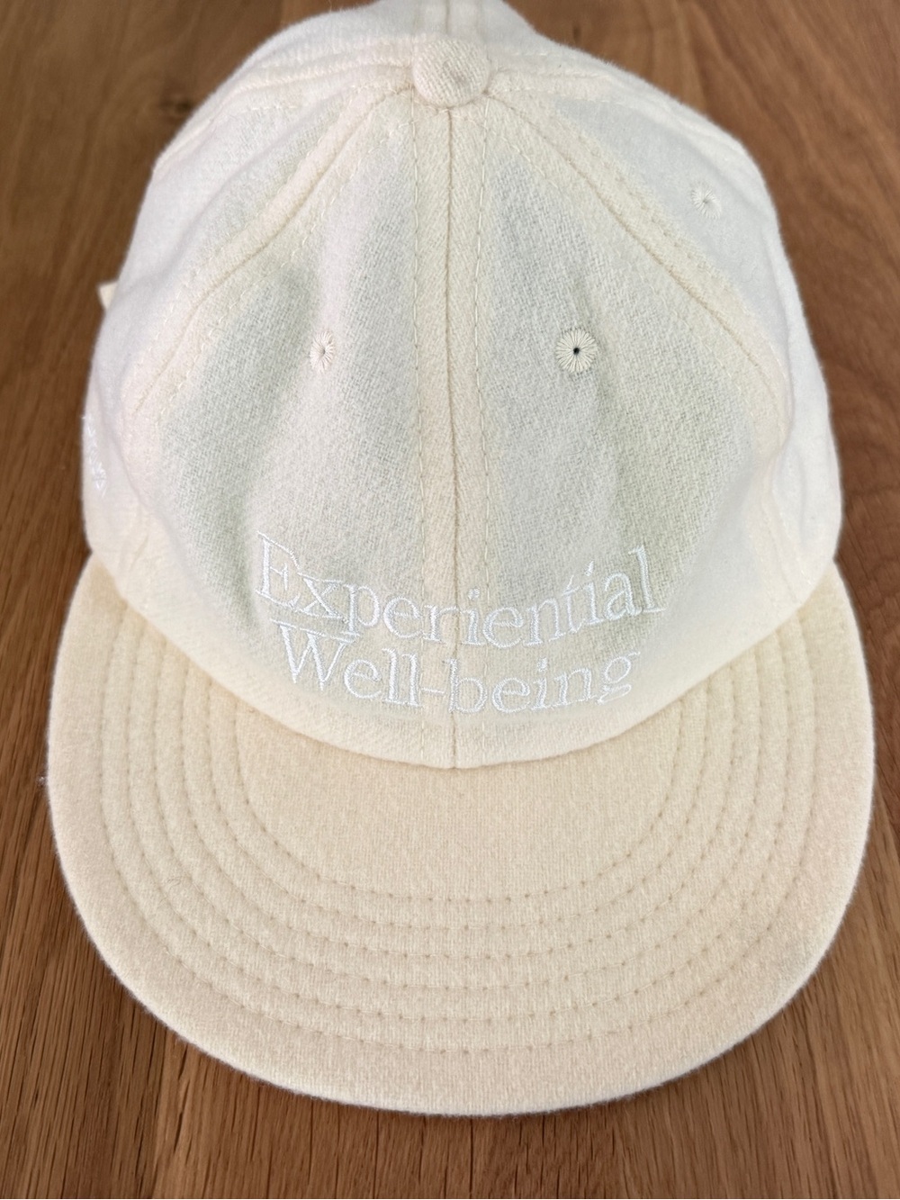 100% Wool Cream Embroidered 'Experiential Well-being' Baseball Cap
